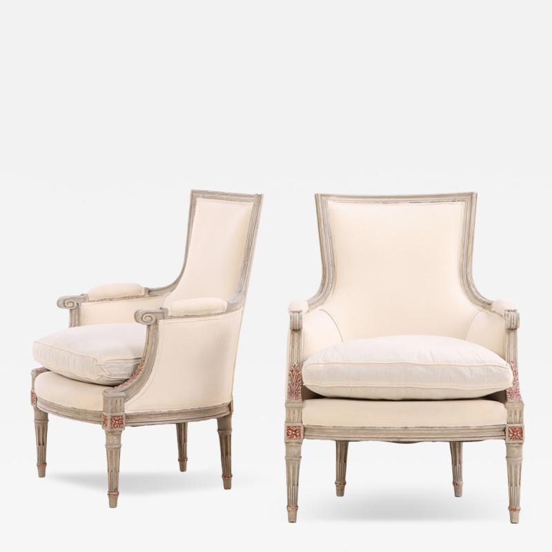 A Pair of Louis XVI Style Grey Painted and Partial Gilt Bergere Chairs C 1940 