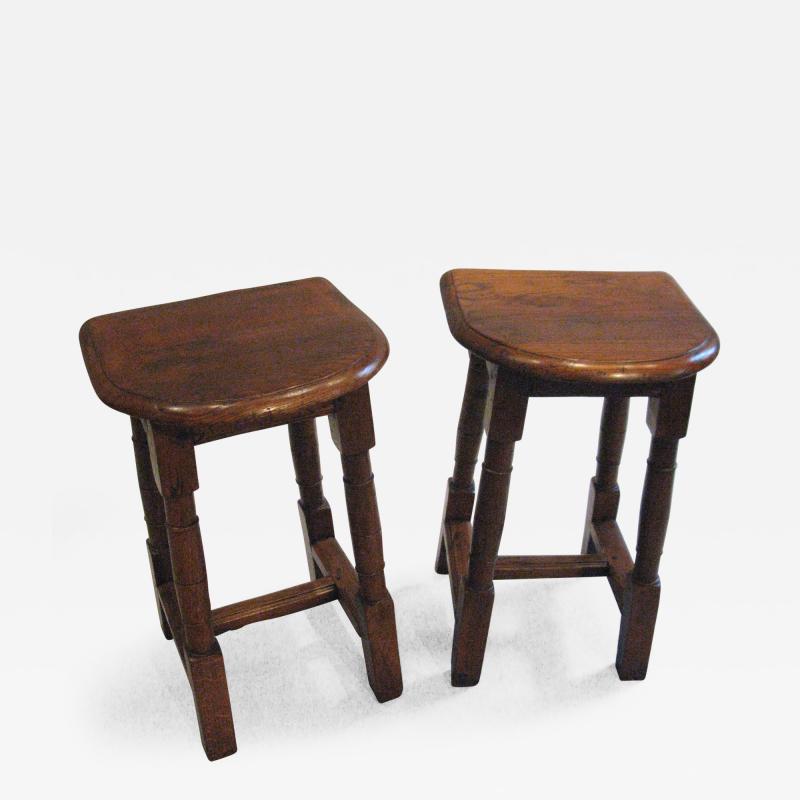 A Pair of Oak Choir or Joint Stools with Shaped Tops and Columnar Legs