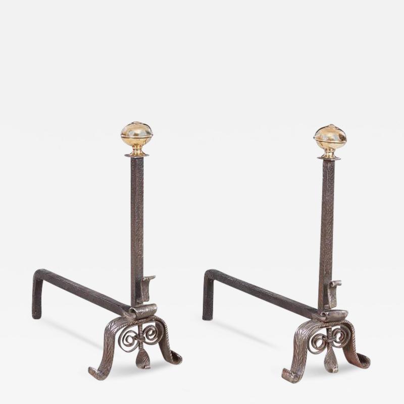 A Pair of Scrolled Iron and Bronze Andirons