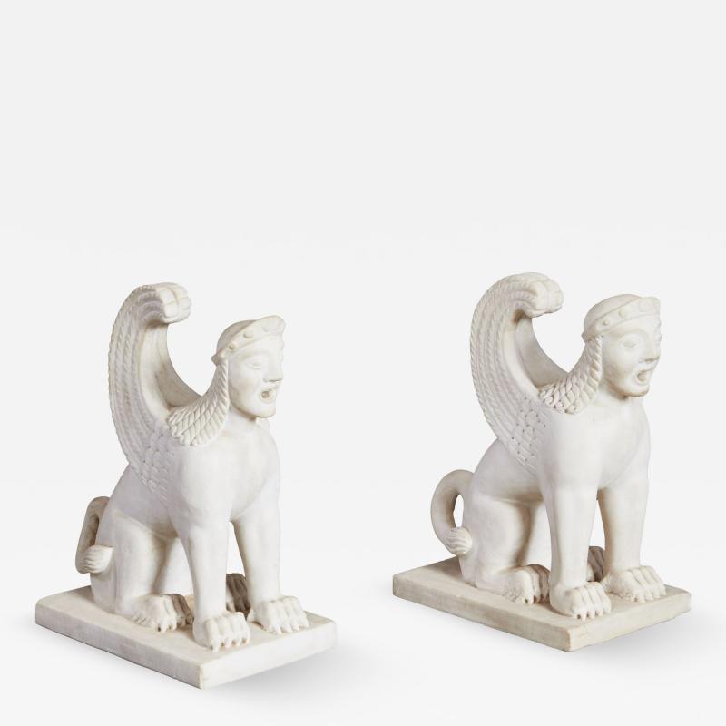A Pair of White Marble Carved Sphinxes