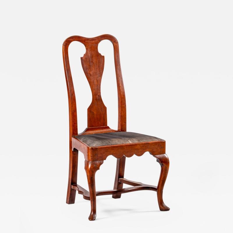 A Philadelphia side chair with original leather seat and stretcher base