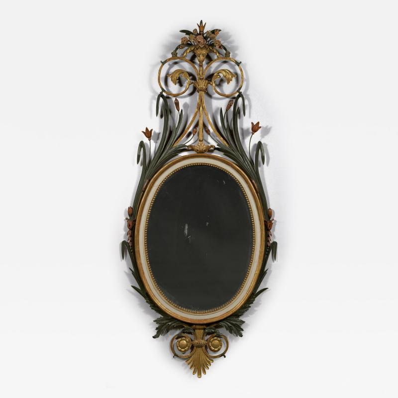 A RARE OVAL GILT WOOD AND PAINTED MIRROR OF LARGE SCALE