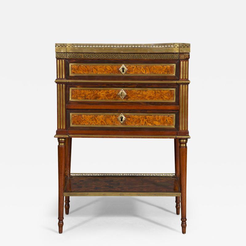 A REMARKABLE NOEUD DE VIGNE VENEERED AND MAHOGANY BRASS INLAID PETITE COMMODE
