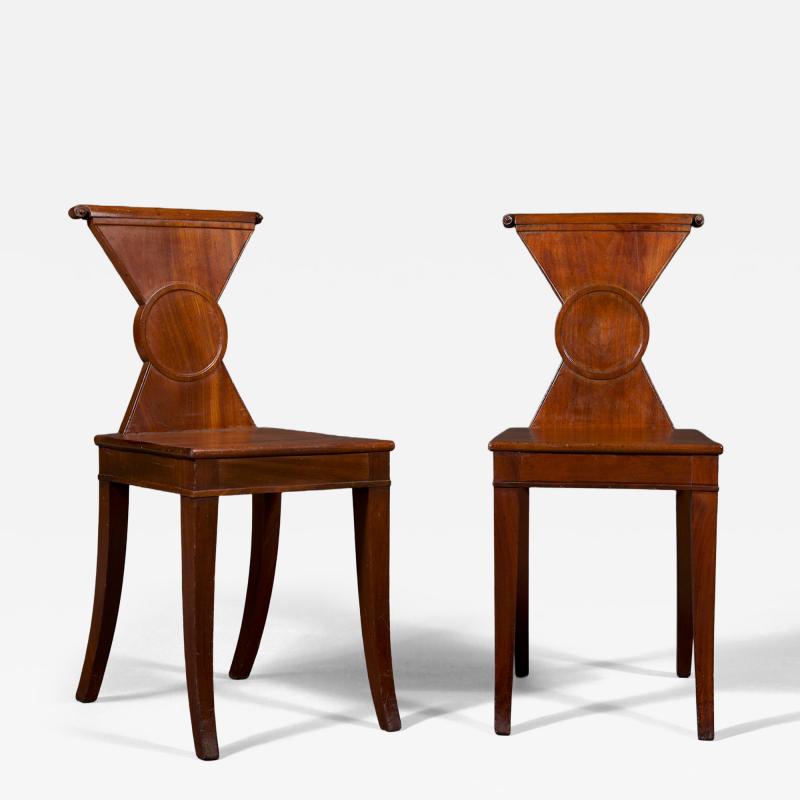A Rare Pair of Regency Mahogany Hourglass Form Hall Chairs