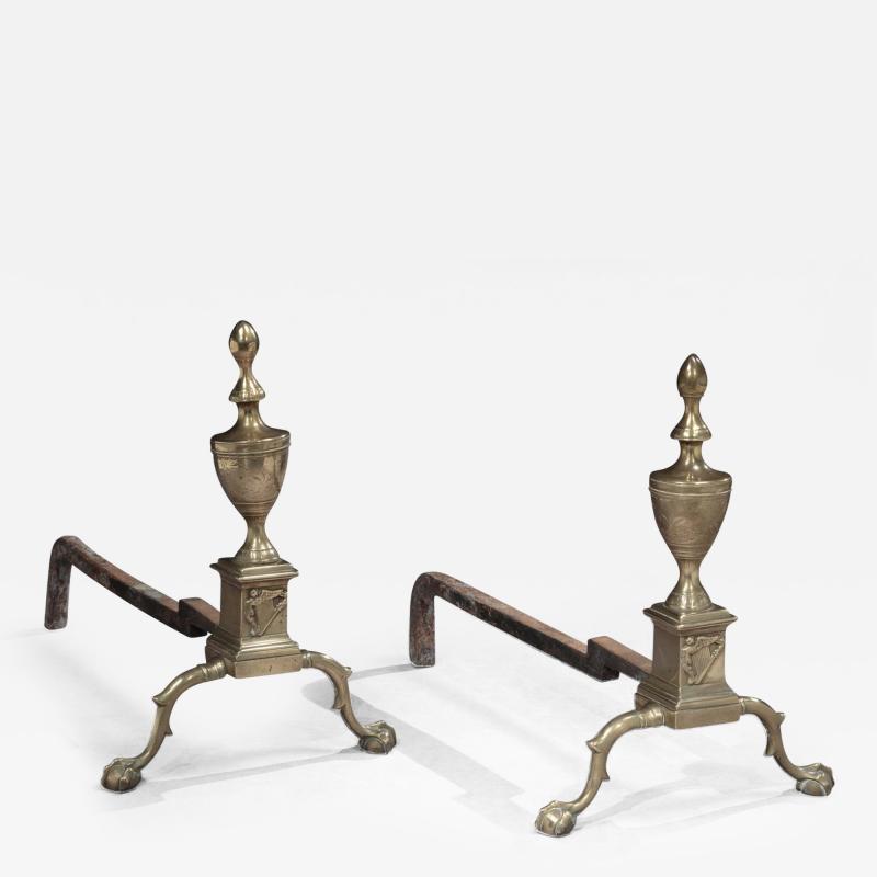 A Rare and Important Pair of Brass Andirons