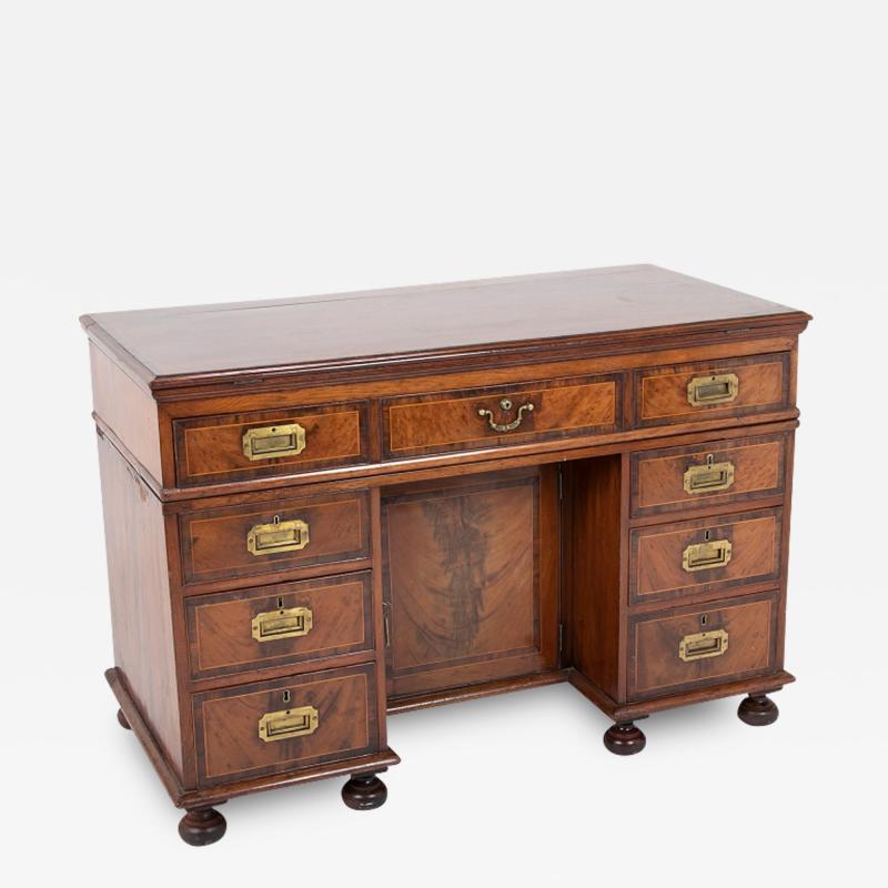 A Regency Double Two Part Ratchet Top Campaign Desk