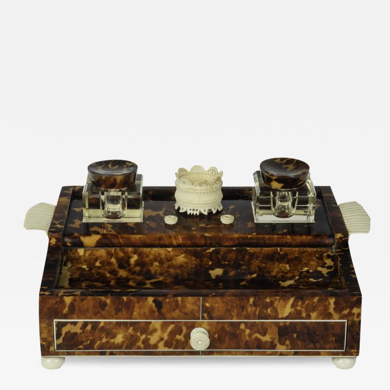 A Regency tortoiseshell and ivory desk set