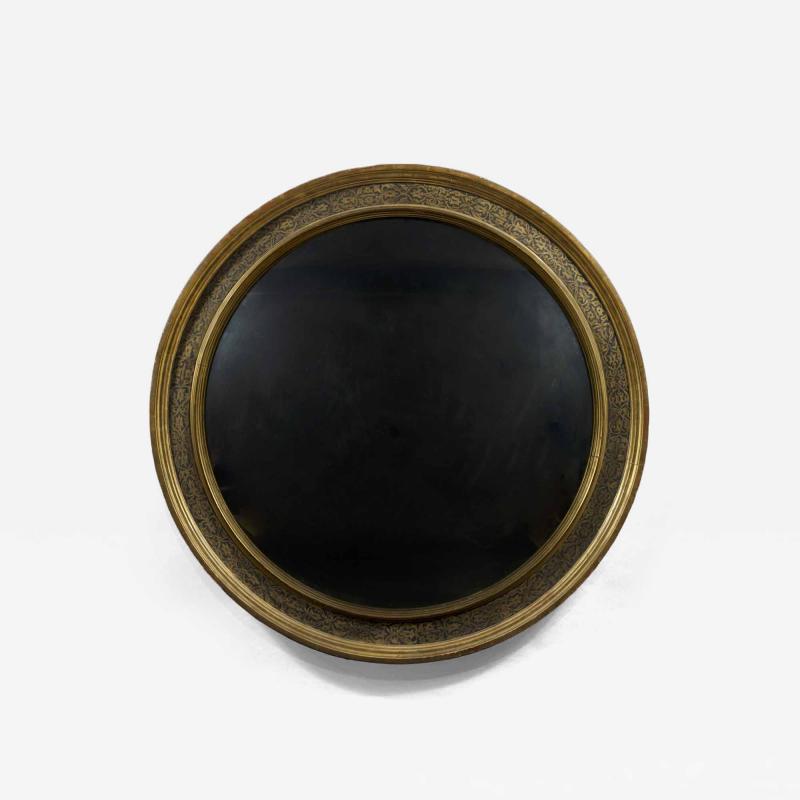 A Renaissance Revival Ebonized and Parcel Gilt Circular Convex Mirror