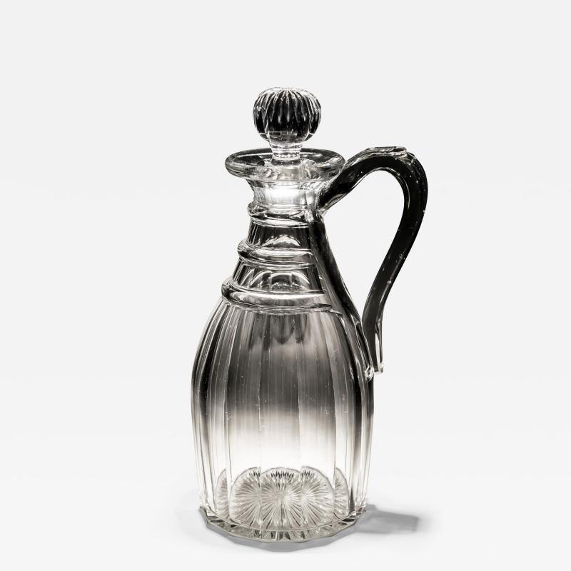 A SLICE CUT REGENCY PERIOD CLARET JUG