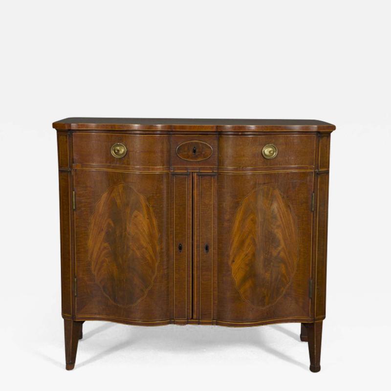 A SUPERB QUALITY FIDDLEBACK AND FLAME MAHOGANY TWO DOOR COMMODE