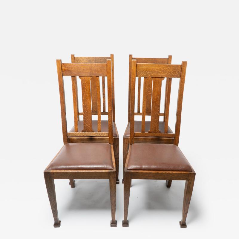 A Set of Four Arts Crafts Oak Dining Chairs with Comfortable Shaped Backs