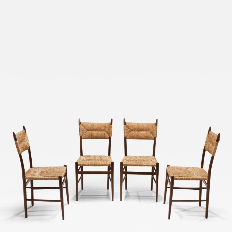 A Set of Four Dining Chairs with Woven Straw Seats and Backs Europe ca 1950s