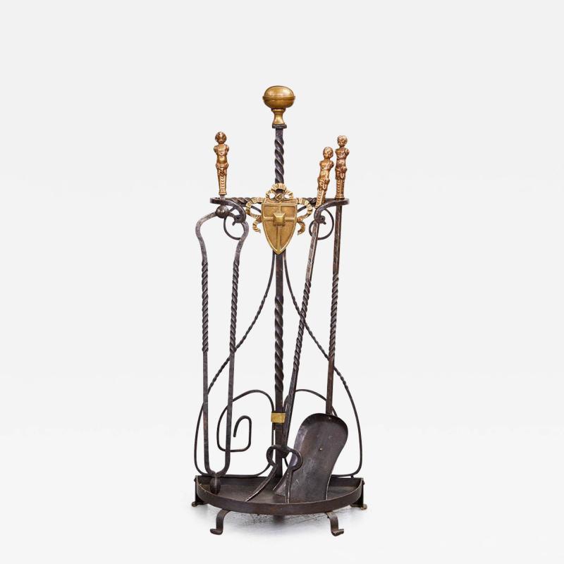A Set of Three Gilded Age Fireplace Tools in Stand