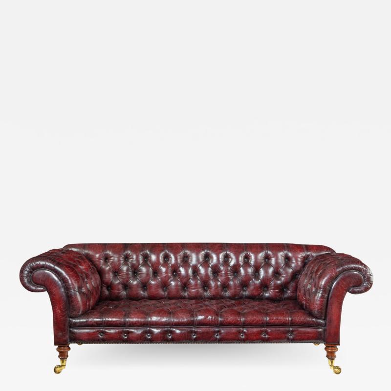 A Victorian deep buttoned Chesterfield settee