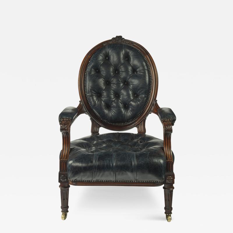 A Victorian rosewood medallion backed open arm chair by Holland Sons