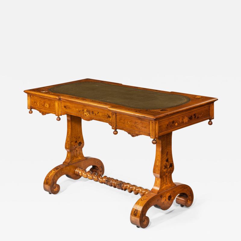 A Victorian walnut marquetry writing table attributed to Edward Holmes Baldock