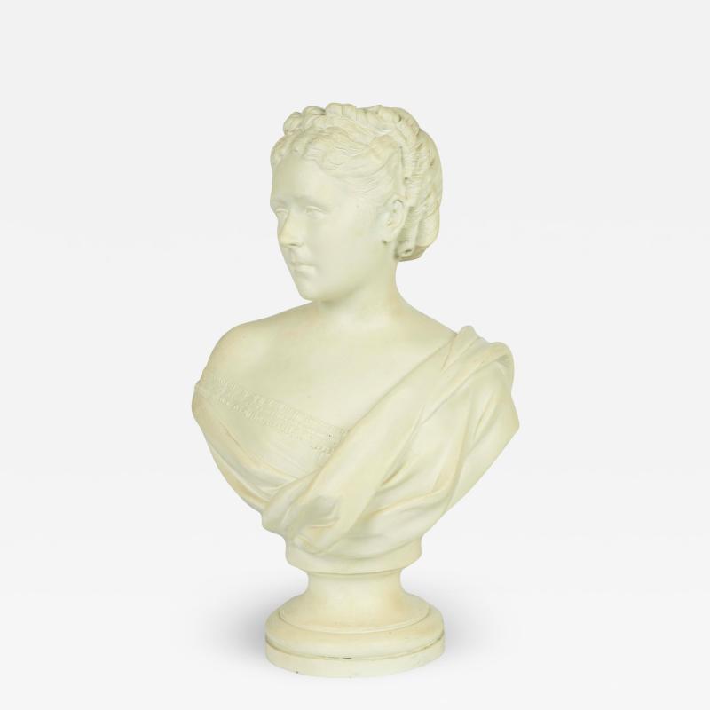 A Victorian white painted terracotta bust of a young woman