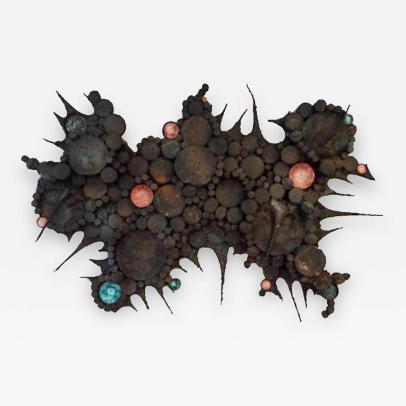 A Wall Sculpture in Blackened Steel and Ceramic