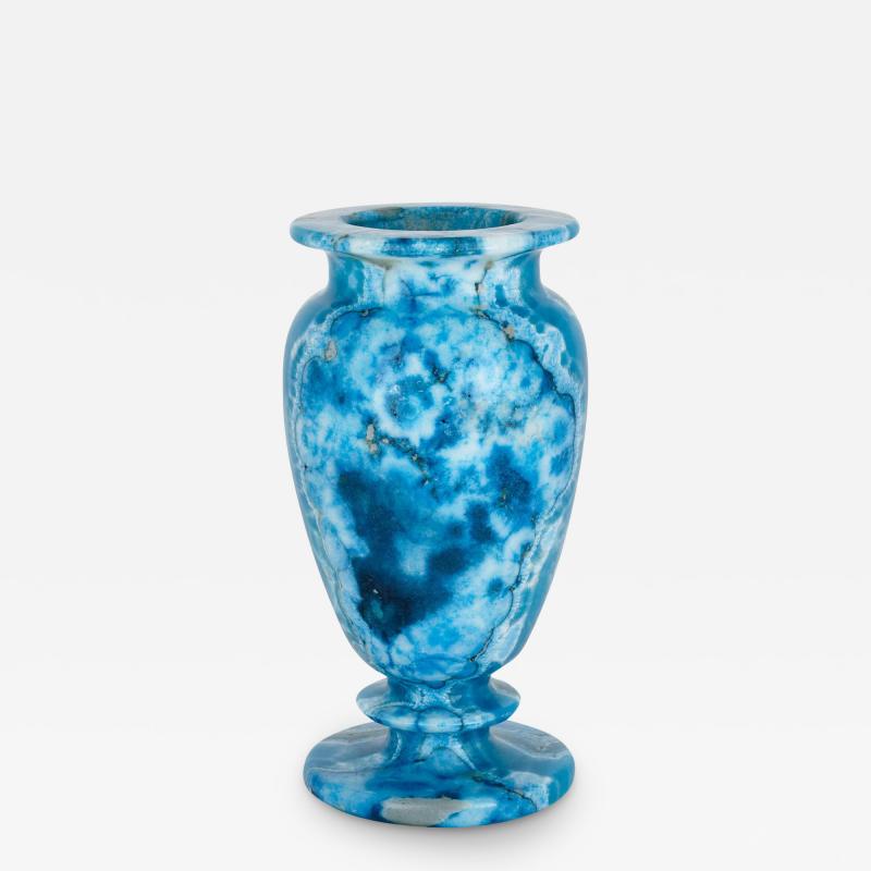 A blue dyed calcite urn shaped mineral vase