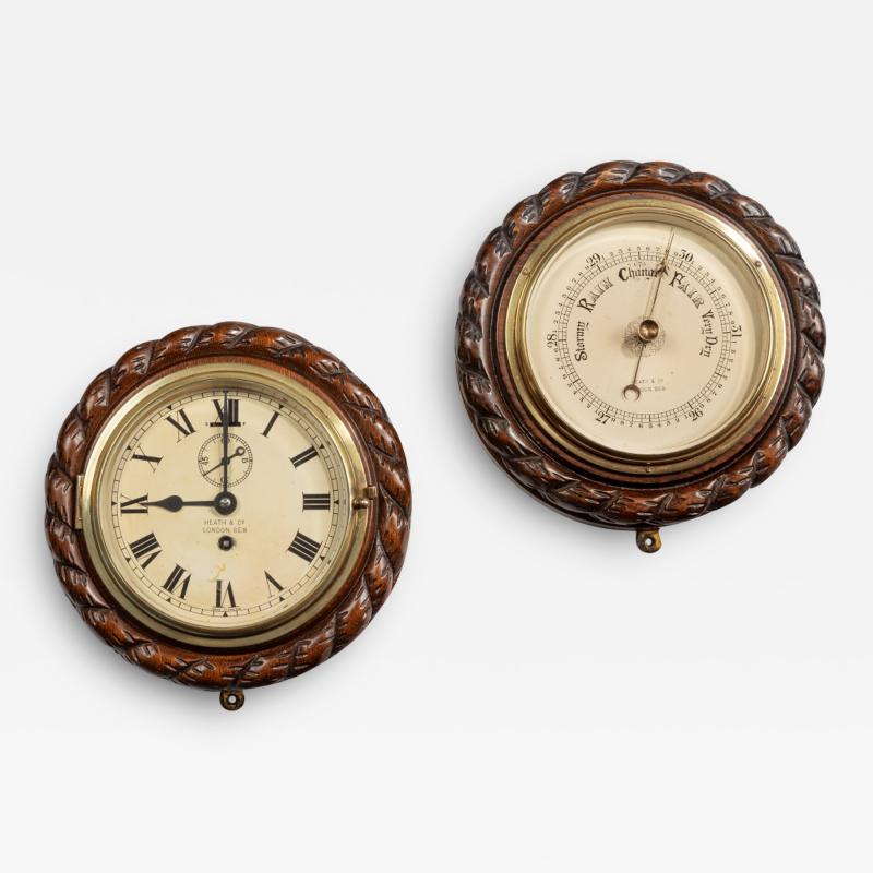 A bulkhead clock and barometer set by Heath Co