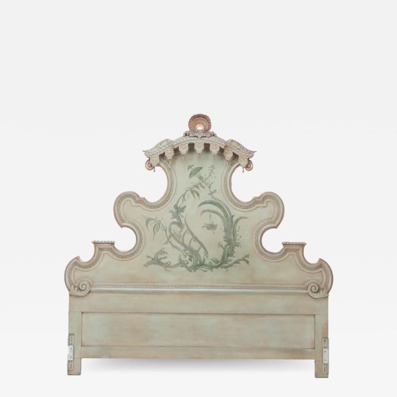 A carved wood and Painted king size headboard Italian C 1950