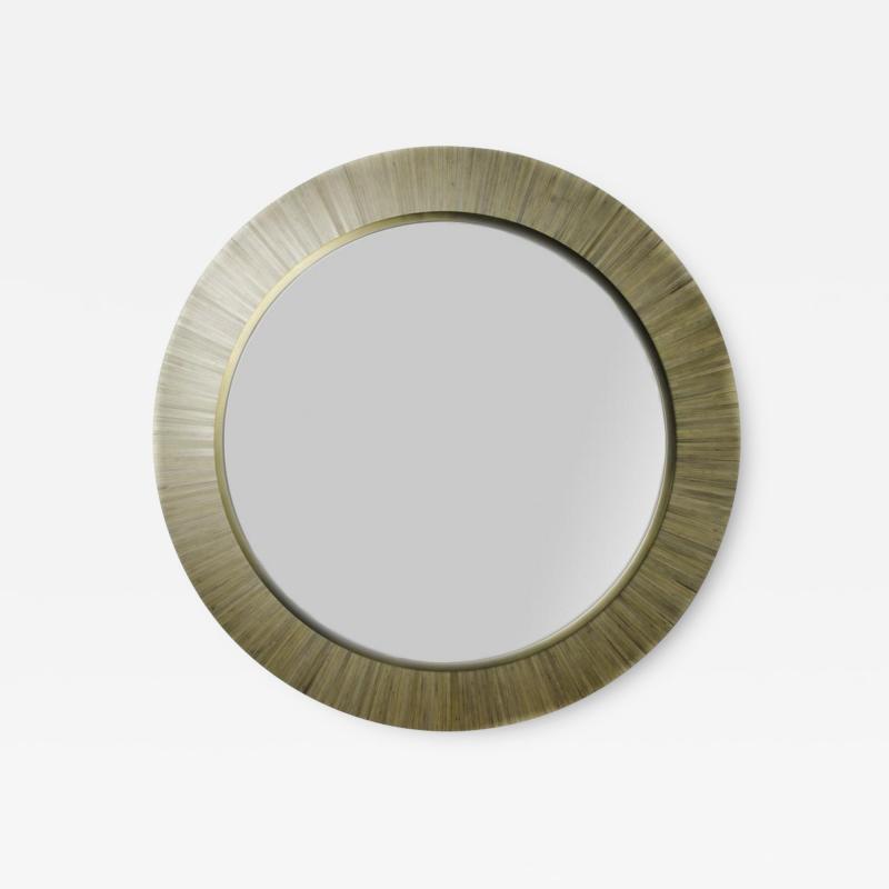 A contemporary modernist round mirror executed in meticulous straw marquetry 