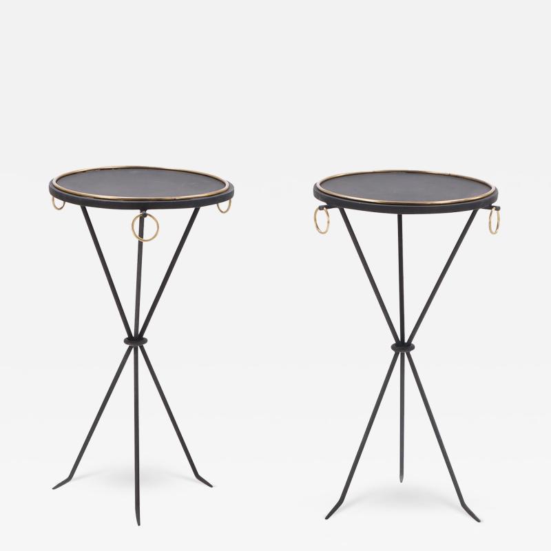 A contemporary pair of wrought iron drink tables having ring decoration 