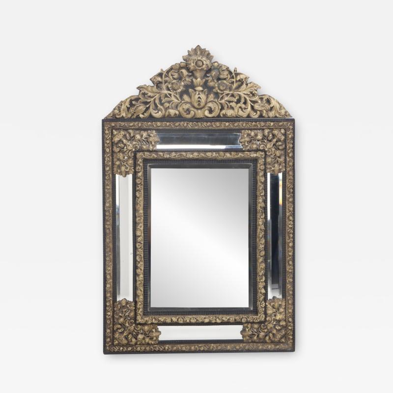 A continental brass repouse cushion mirror circa 1890 