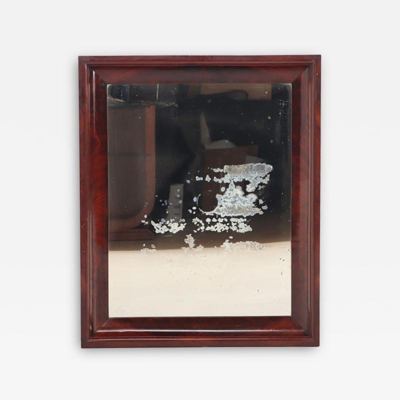 A crotch mahogany Empire wall mirror circa 1830 