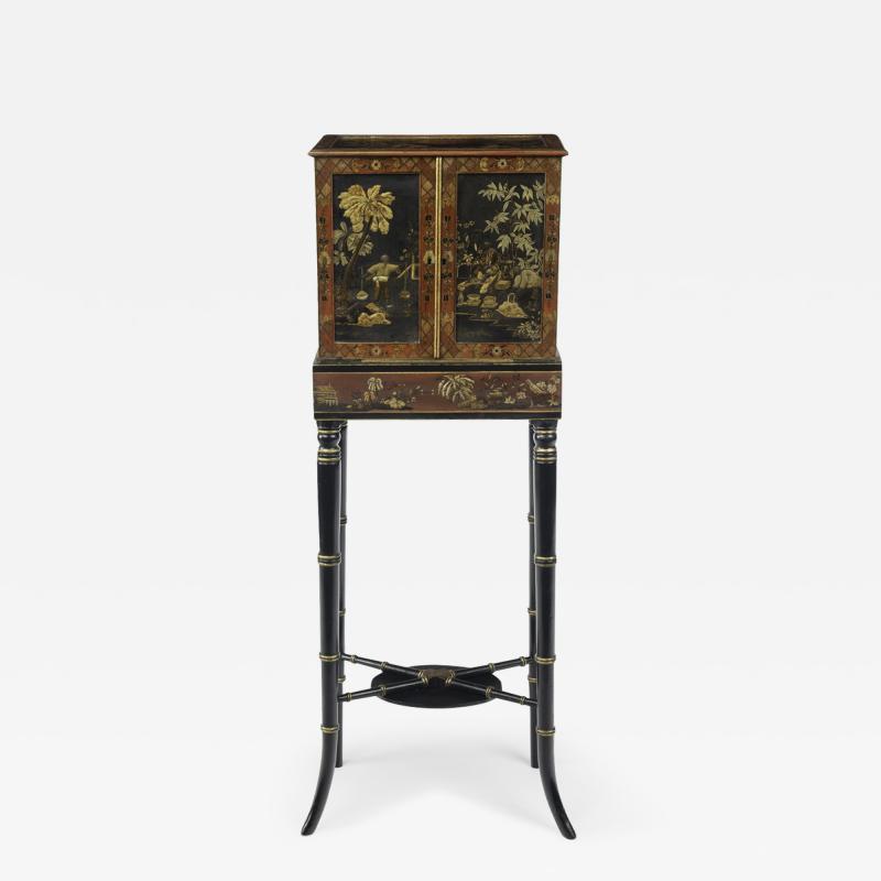 A delicate Regency Chinoiserie lacquer cabinet