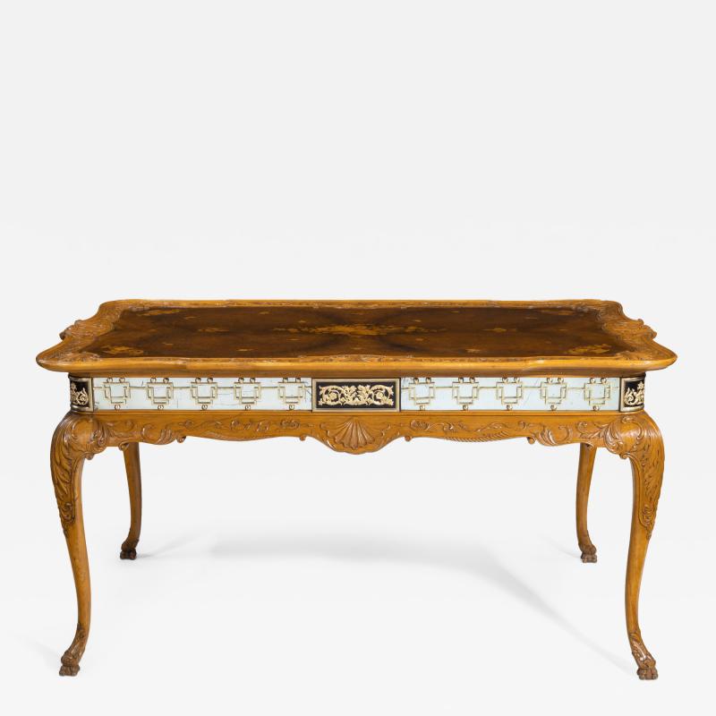 A fine walnut and burr walnut Orientalist centre table