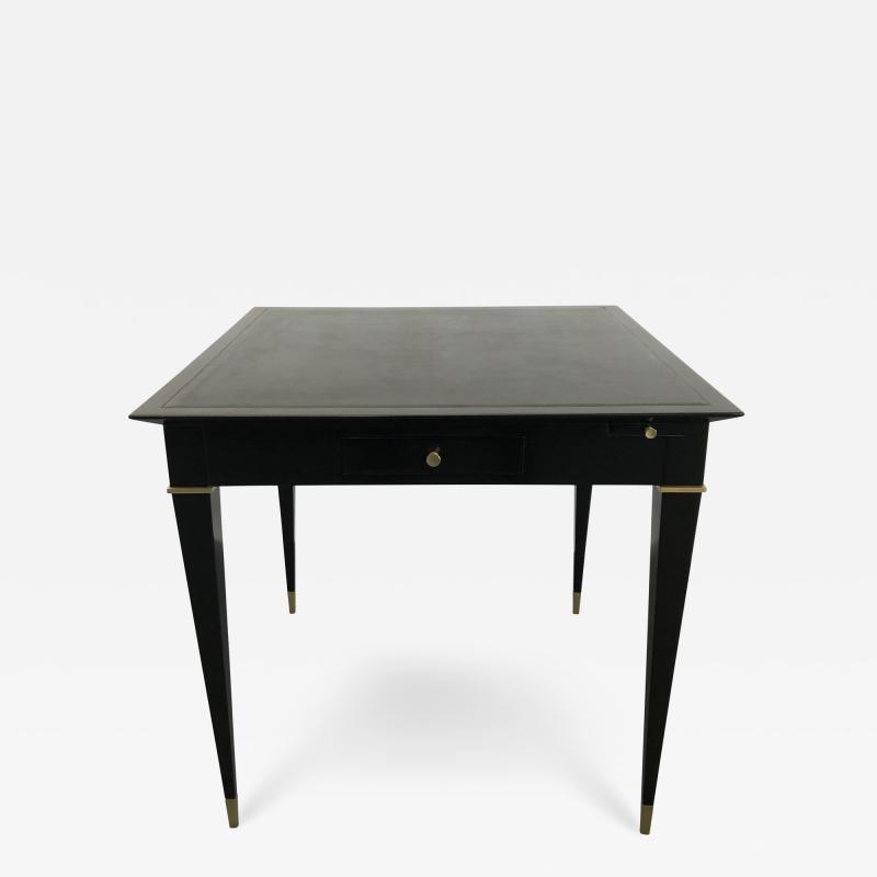 A game table ebonized mahogany bronze details and leather top 