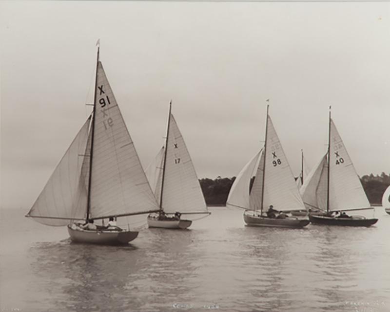 A gelatine print of boats in light airs sailing in the 1954 Cowes regatta