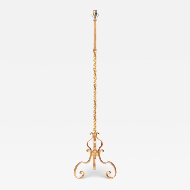 A gilt iron floor lamp in the manner of Raymond Subes C 1940 