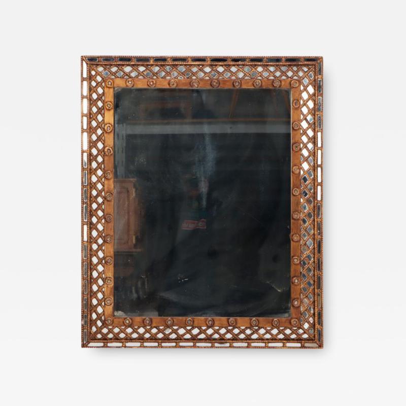 A gold mirror with lattice design circa 1950 
