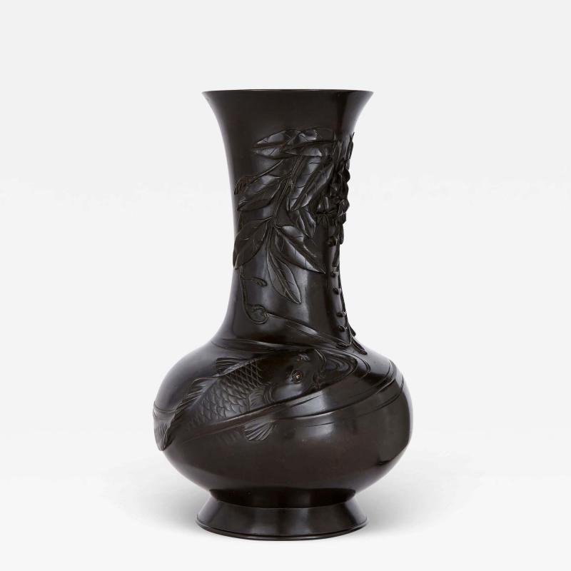 A gold shakudo Meiji period bronze vase of carp in wisteria