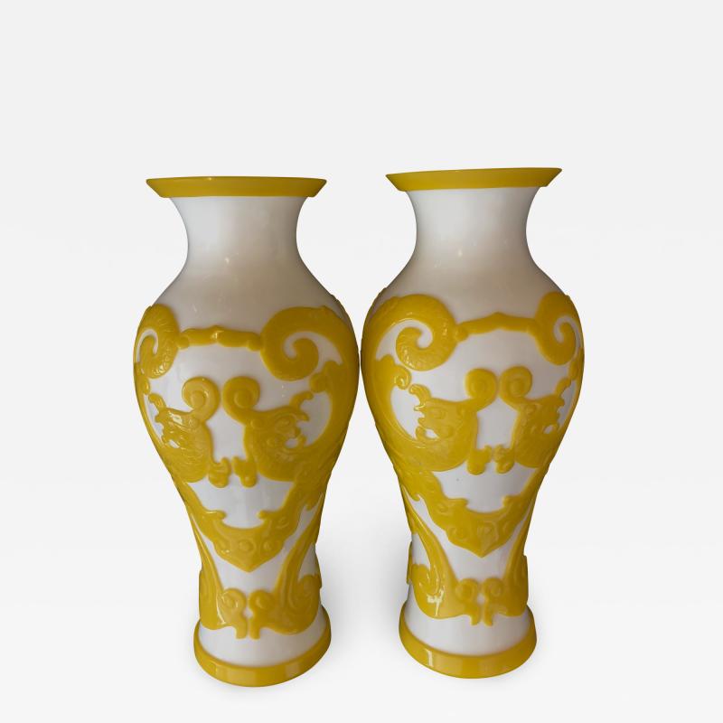 A good quality pair of Chinese Imperial yellow over white baluster form vases