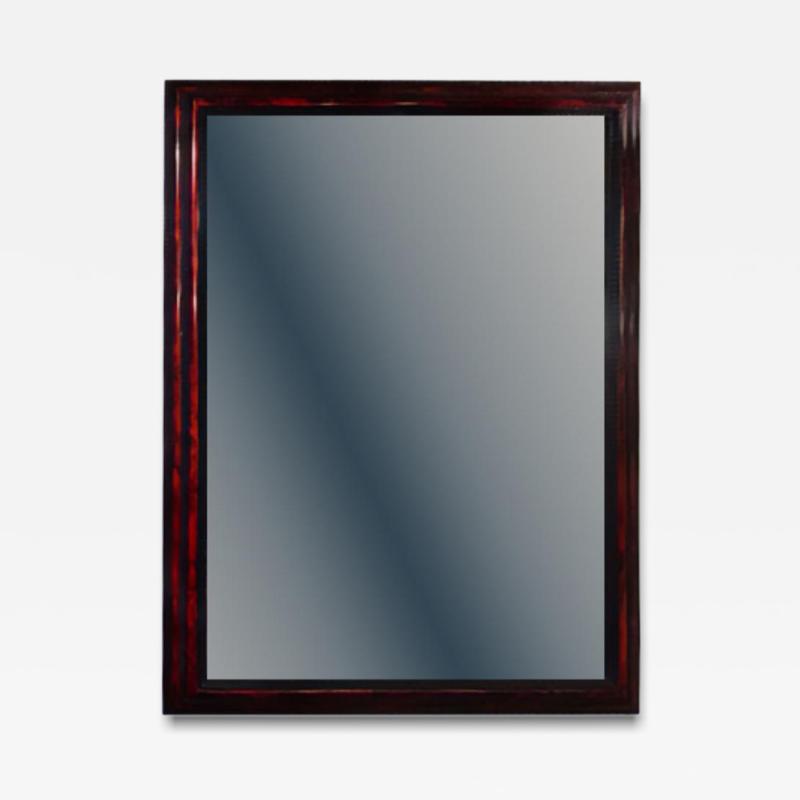 A large French ripple carved and faux tortoiseshell cushion mirror 