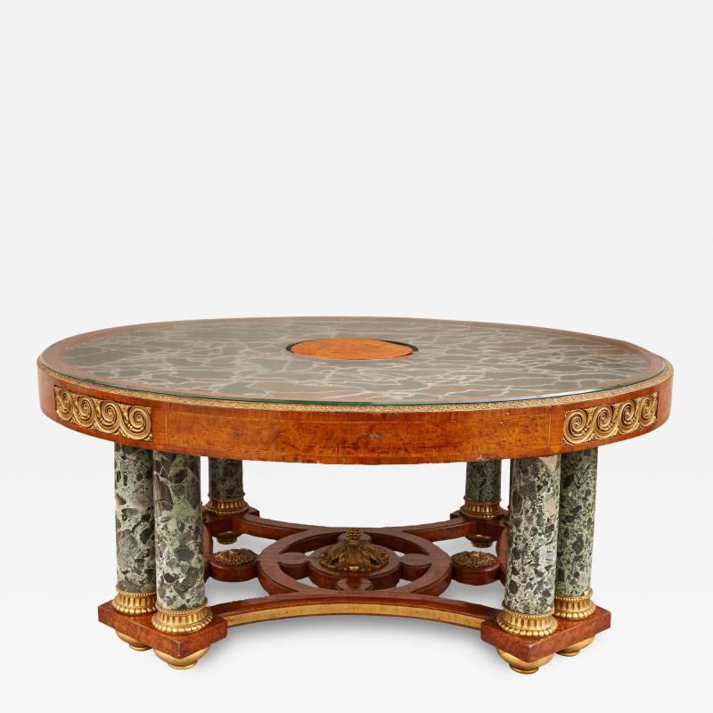 A large amboyna stained glass marble and ormolu mounted centre table