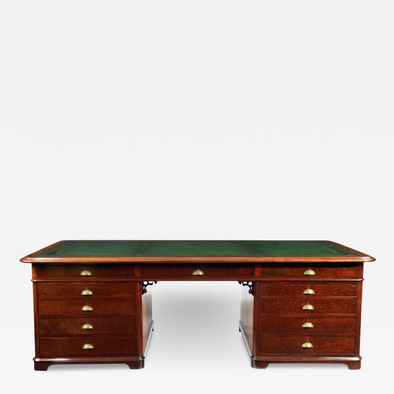 A large and imposing Victorian mahogany partners desk