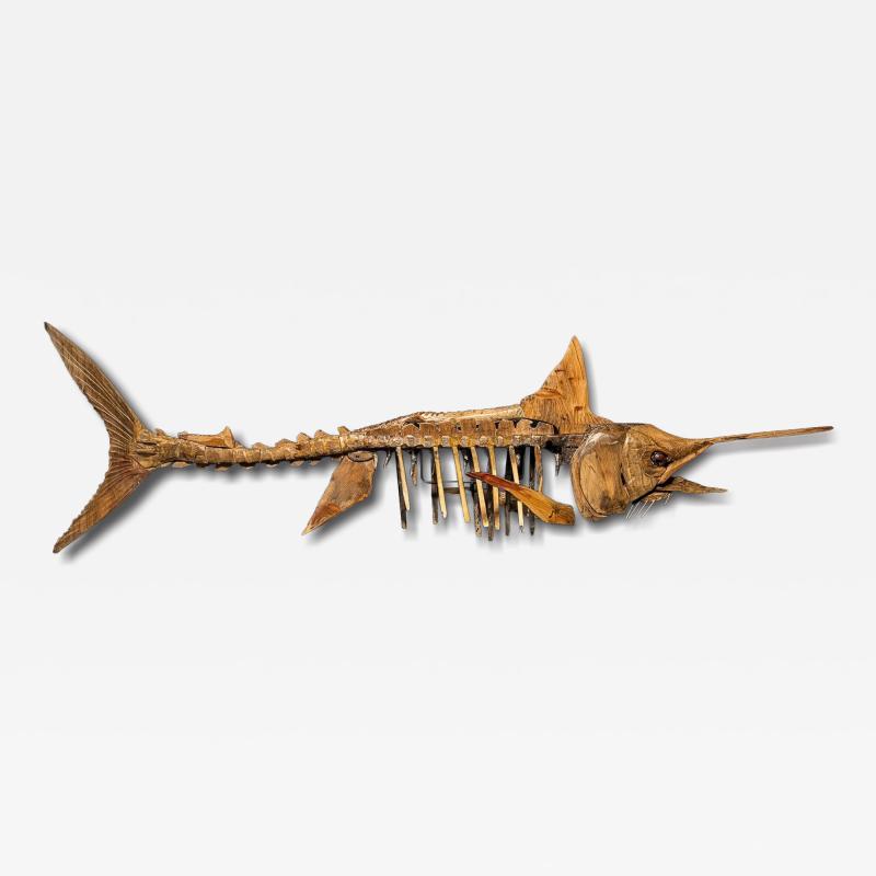 A large handmade wooden sculpture study of a Marlin in skeletal form