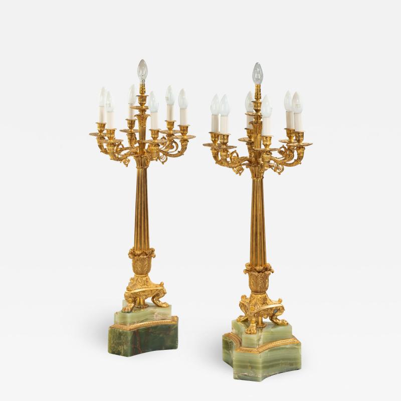 A large pair of onyx and ormolu lamps