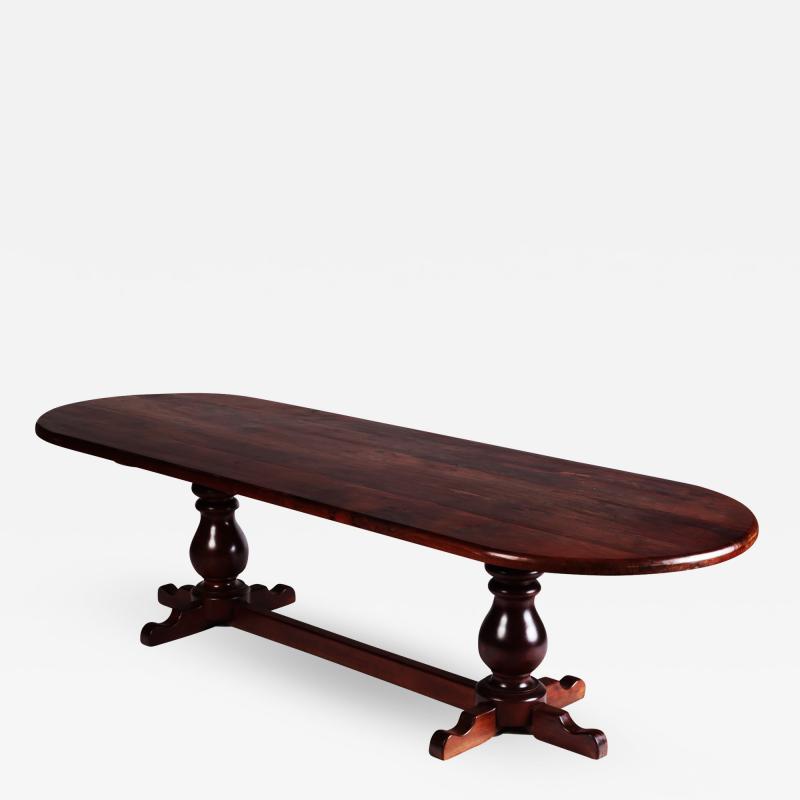 A large slab top Brazilian oval shape trestle table circa 1960 