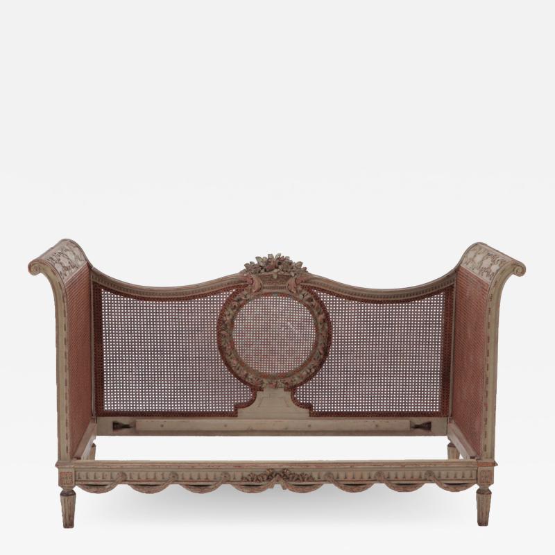 A late 19th Century French Directoire painted cane Daybed settee C 1880