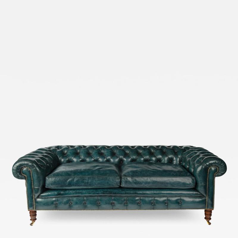 A late Victorian two seater Chesterfield sofa