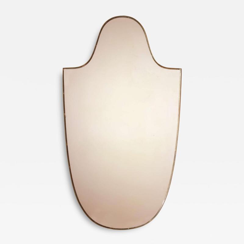 A mid century brass mirror with a shield shaped frame Italy 1950s 