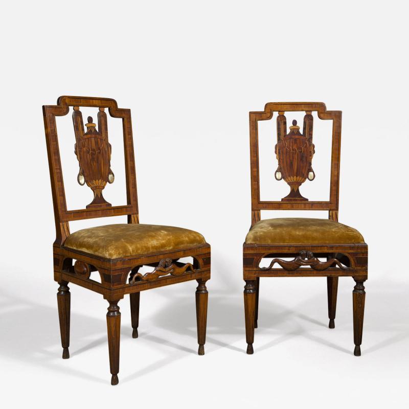 A most unusual set of four neoclassical marquetry inlaid chairs and a settee