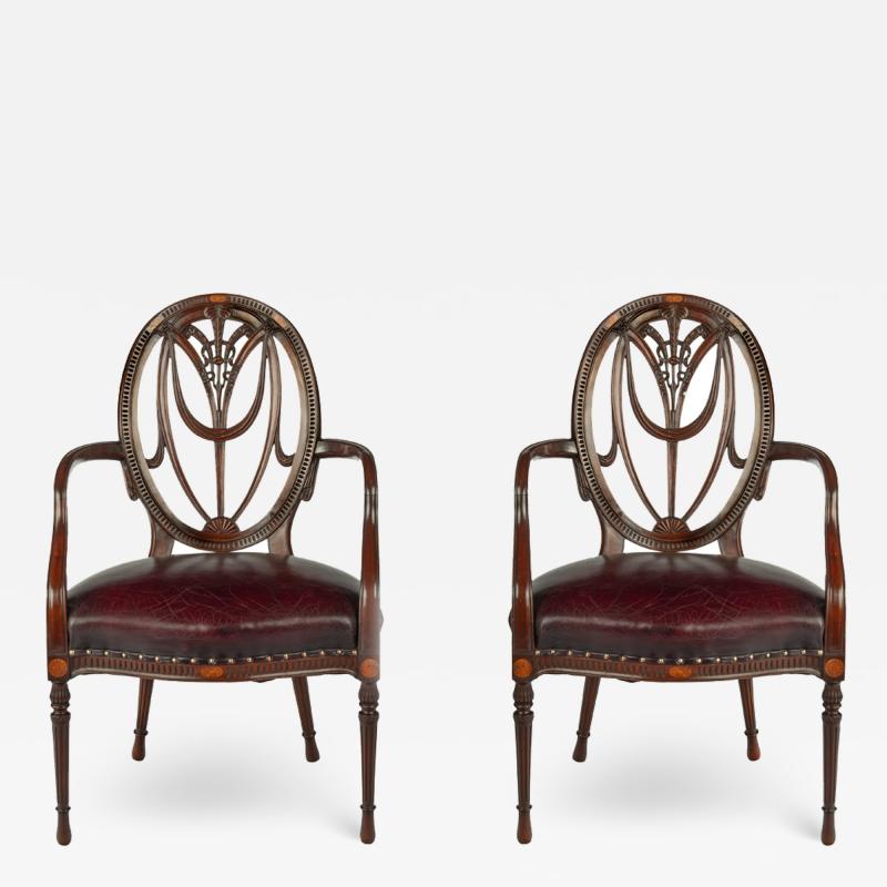 A pair mahogany Hepplewhite style arm chairs