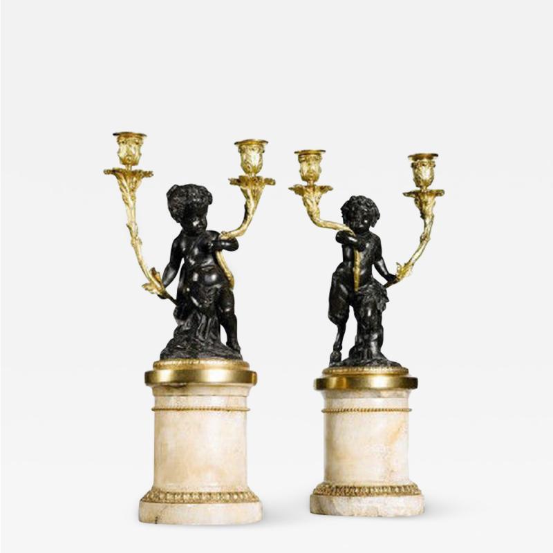 A pair of 19th century bronze ormolu and fluorspar candelabra