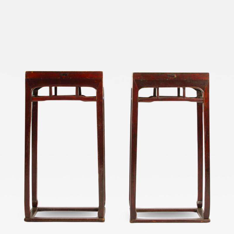 A pair of Chinese hardwood tall side tables pedestals circa 1900